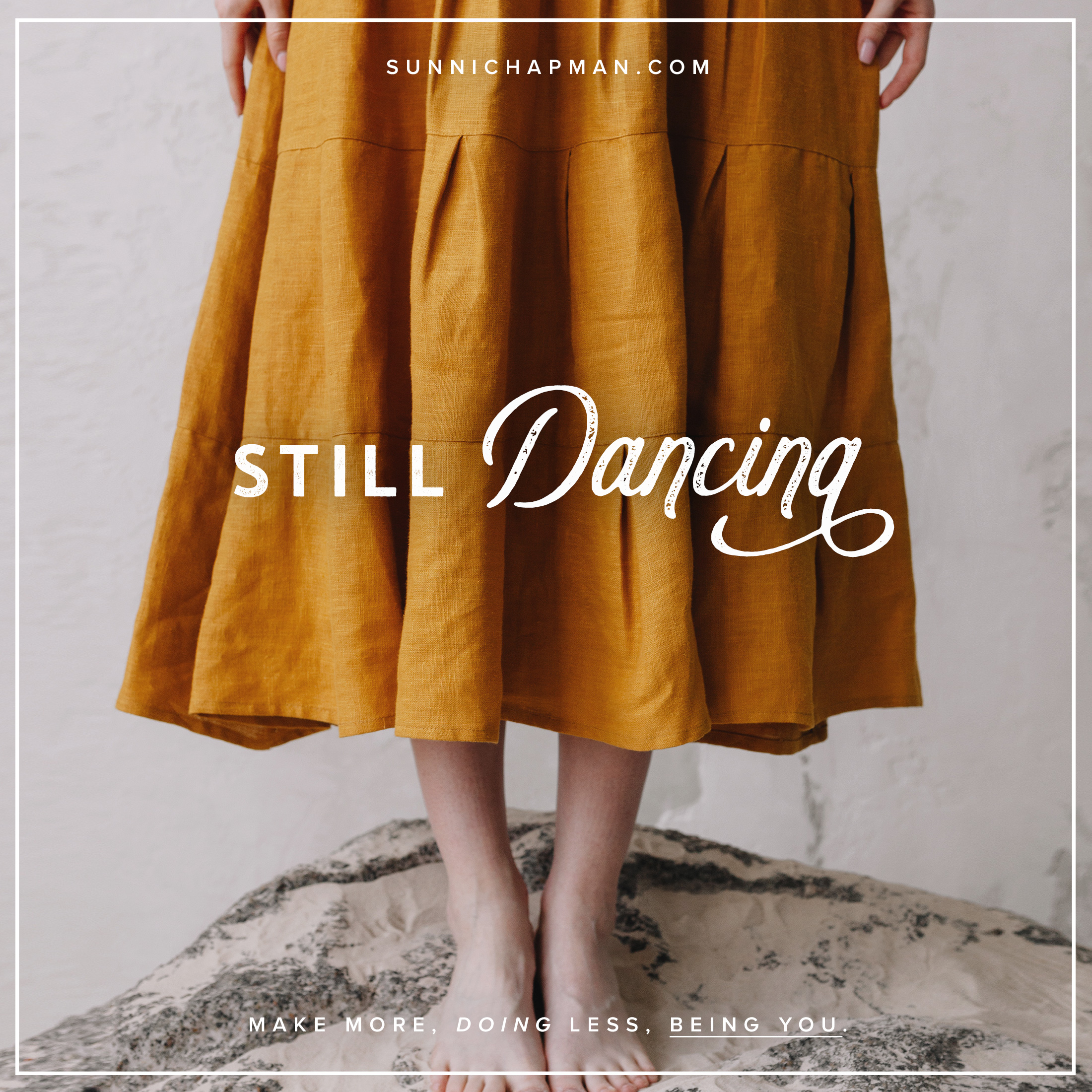 A picture of a woman standing in an ocher dress, the picture shows only the woman's lower body, hands beside her body, and feet. Text over it: Still Dancing