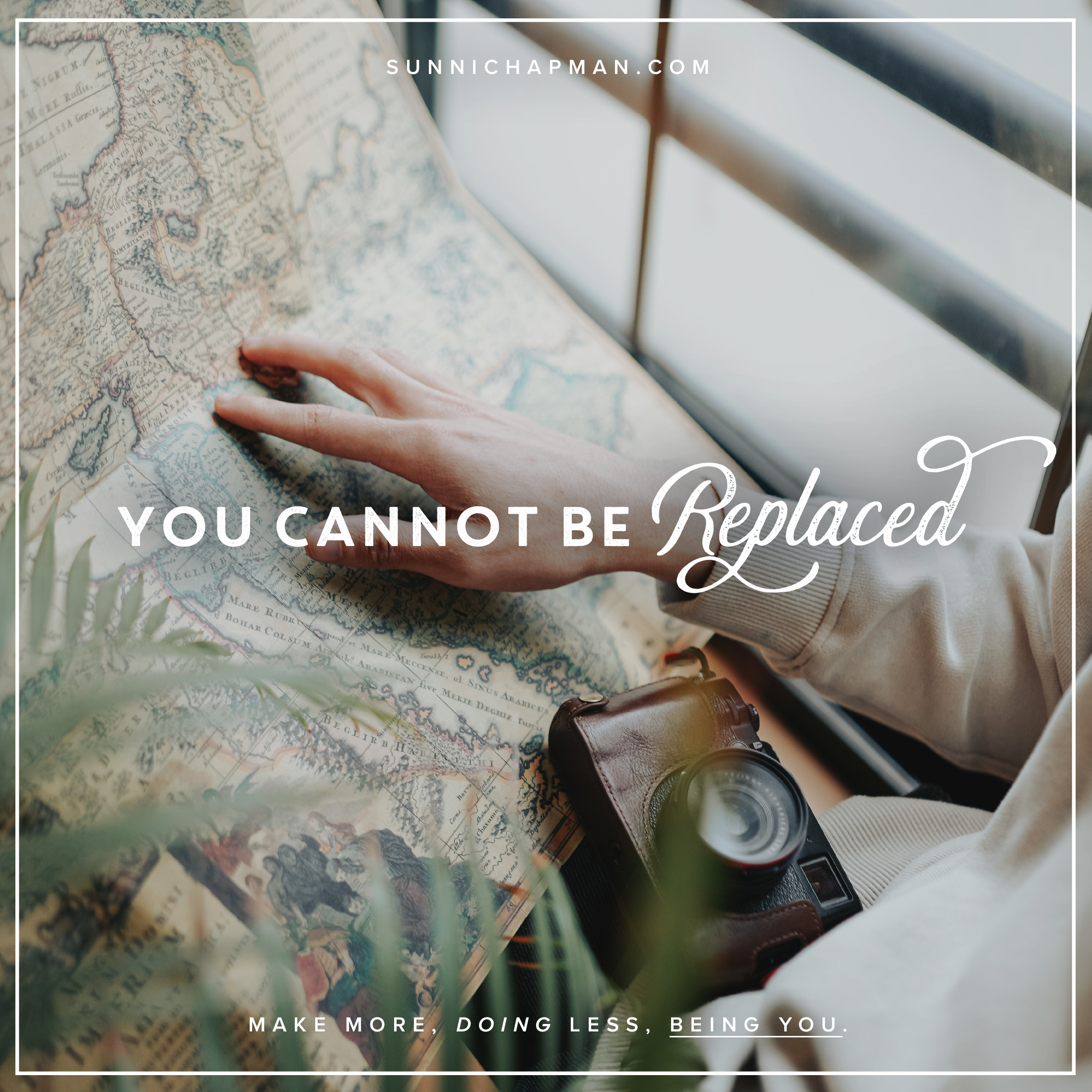 Woman hand on a paper map, with an old camera and text overlay: You Cannot Be Replaced
